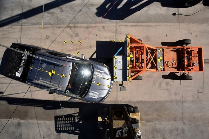 Overhead view of a frontal oblique crash test against a moving barrier